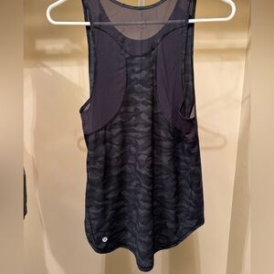 Lululemon black camo workout shirt. Women’s size 10. Worn once!